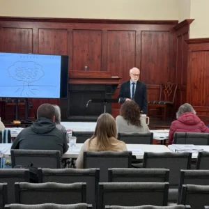 Brad Beevers teaching from an open Bible