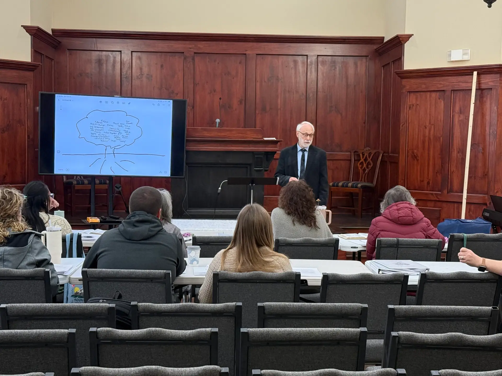 Brad Beevers teaching from an open Bible