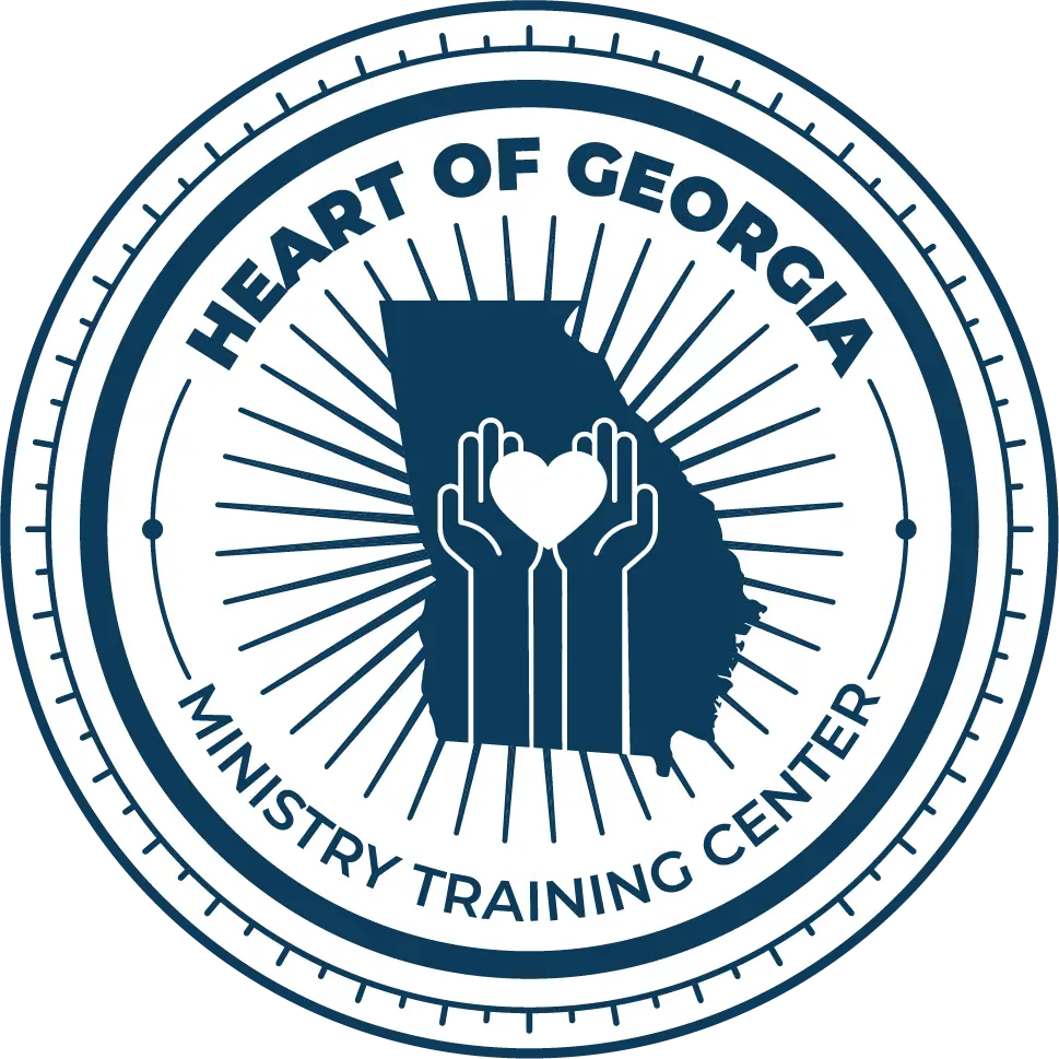 Heart of Georgia Ministry Training Center seal — hands holding a heart over the state of Georgia